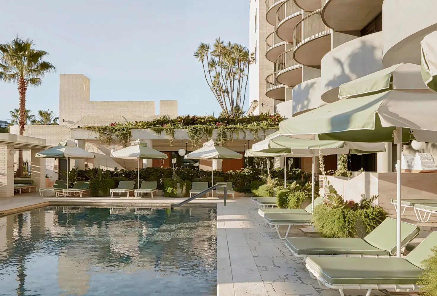 A detail of pool deck planting and cabanas at The Calile.