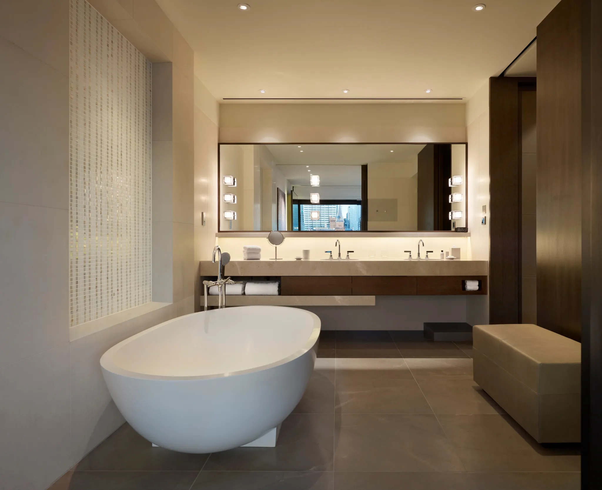 A rooftop suite bathroom with marble bath.